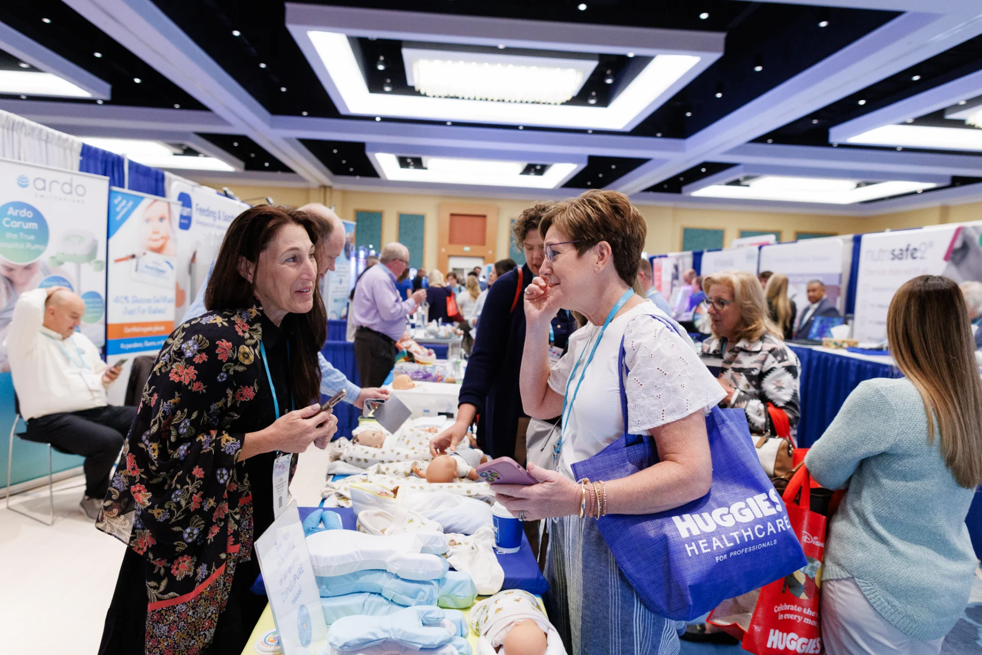 people at an exhibition counter